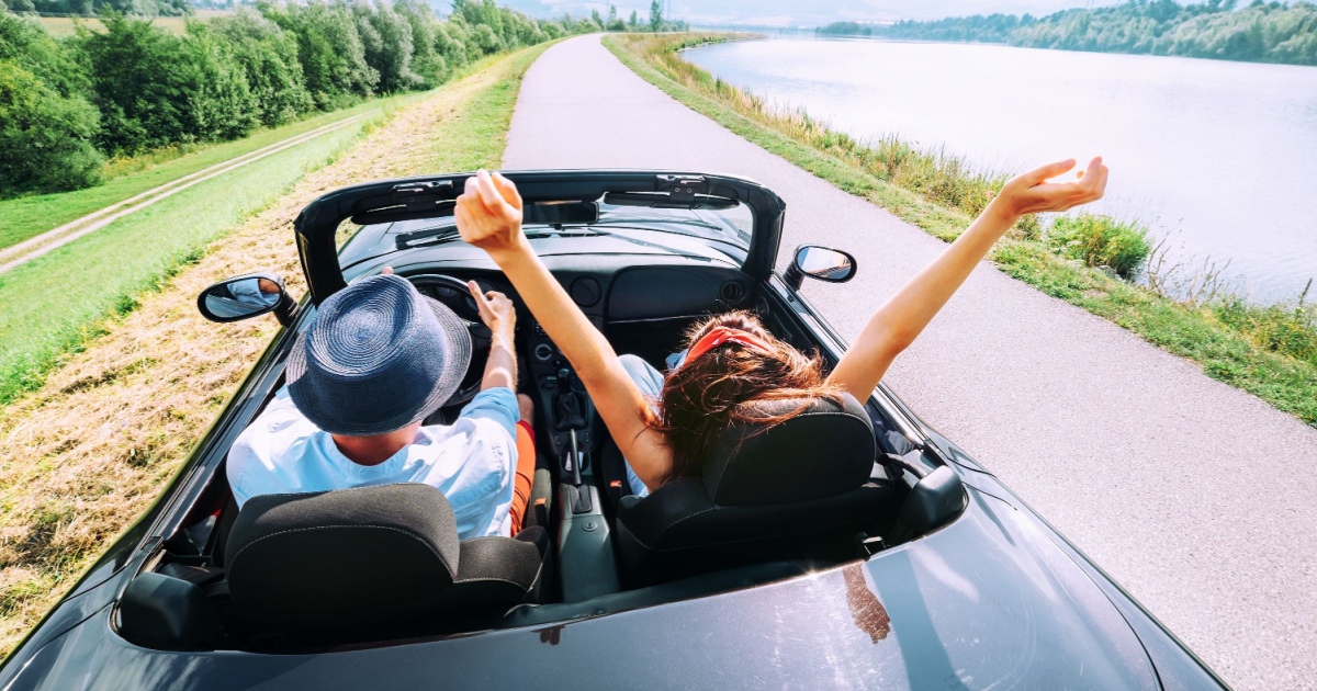 Couple riding in a convertible