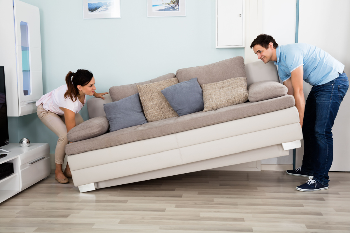 Couple moving furniture - renters insurance