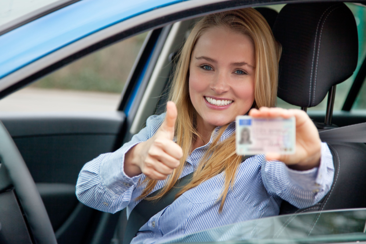 Driver displaying her drivers license