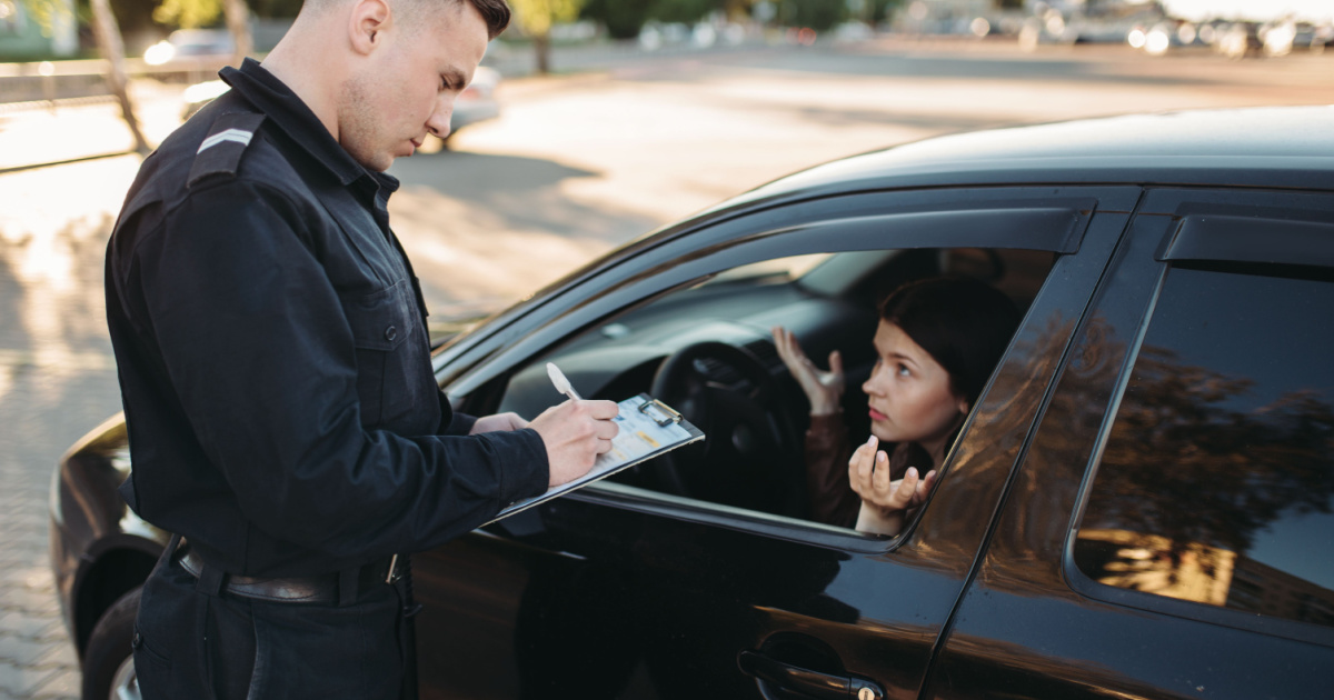 Police officer verifying hardship license