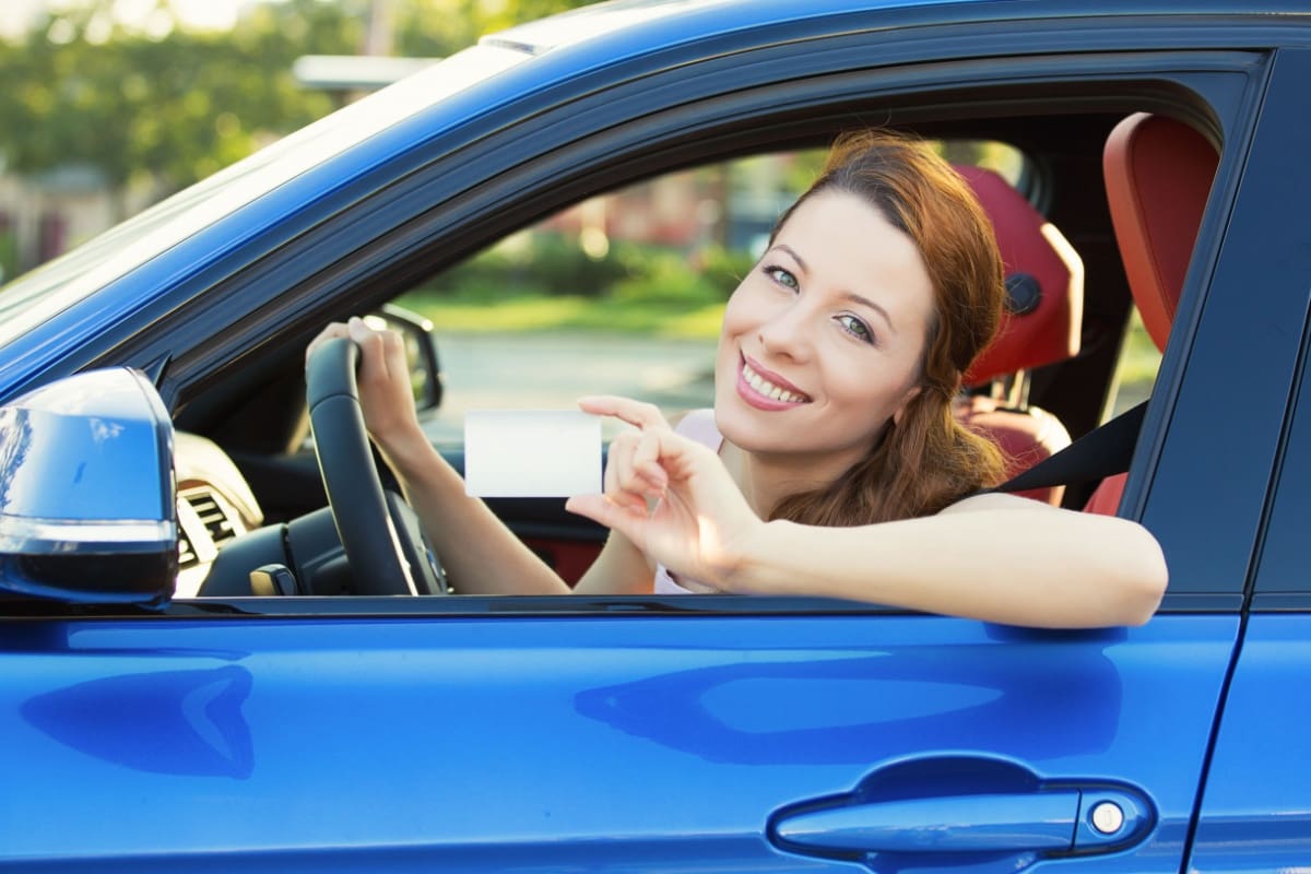 Woman showing her driver license